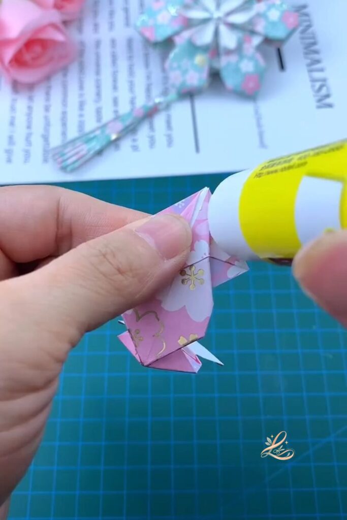  All six completed petal modules laid out in two rows of three on the cutting mat, all facing the same direction, showing the consistent 3D petal shapes before assembly