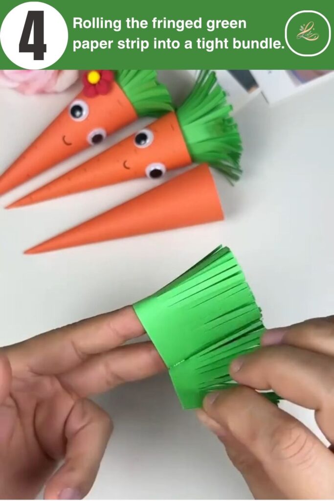 Rolling fringed green paper to create the top of a carrot.