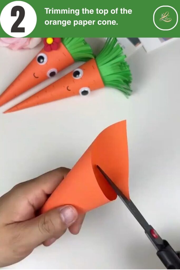 Trimming the top edge of an orange paper cone with scissors.