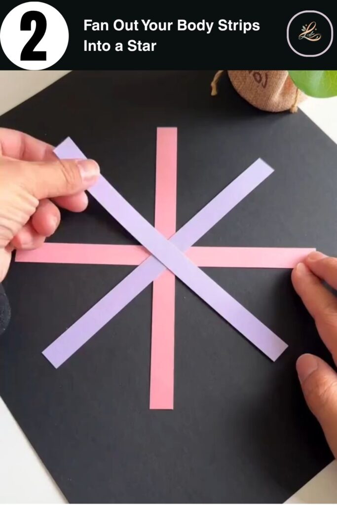 Colorful paper strips arranged in a star pattern on a dark background as part of a paper bag craft for kids tutorial