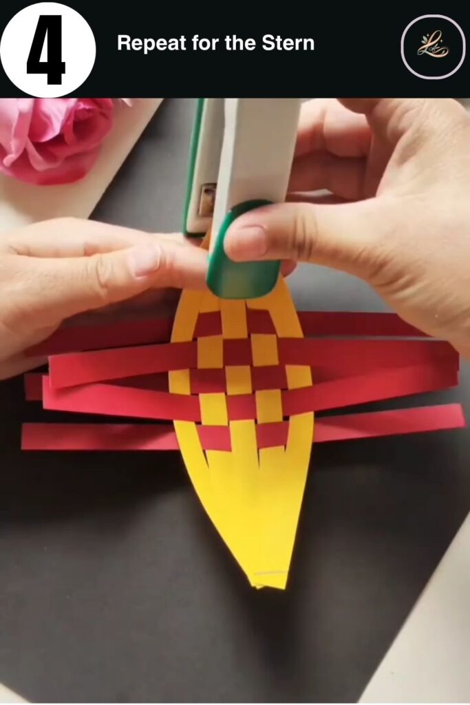 Forming the second pointed end of the woven paper boat