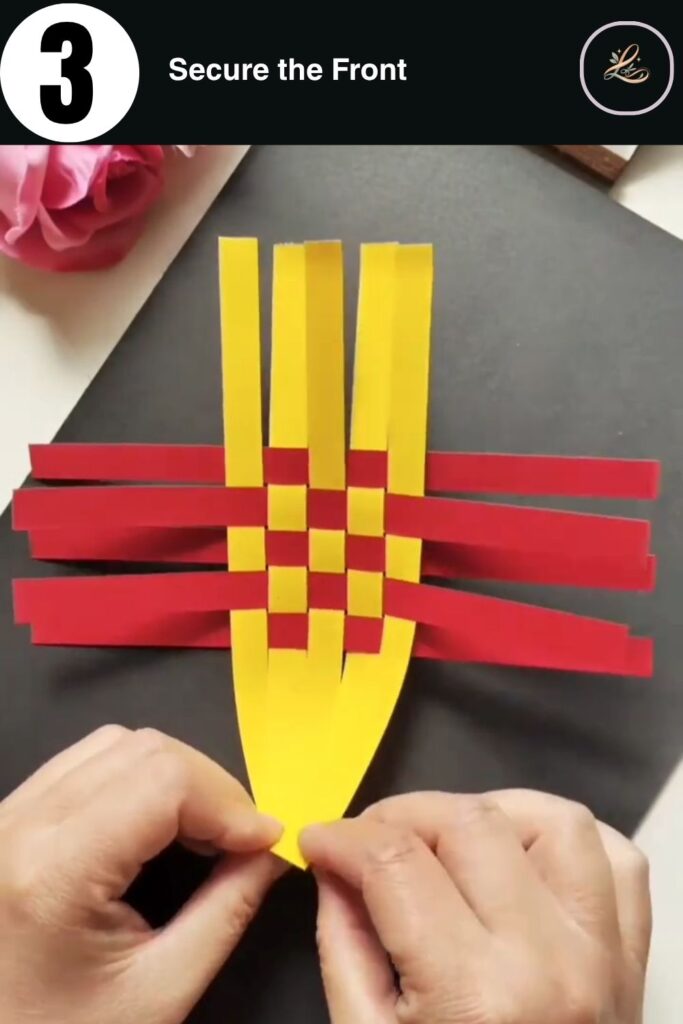 Stapling the ends of yellow paper strips together