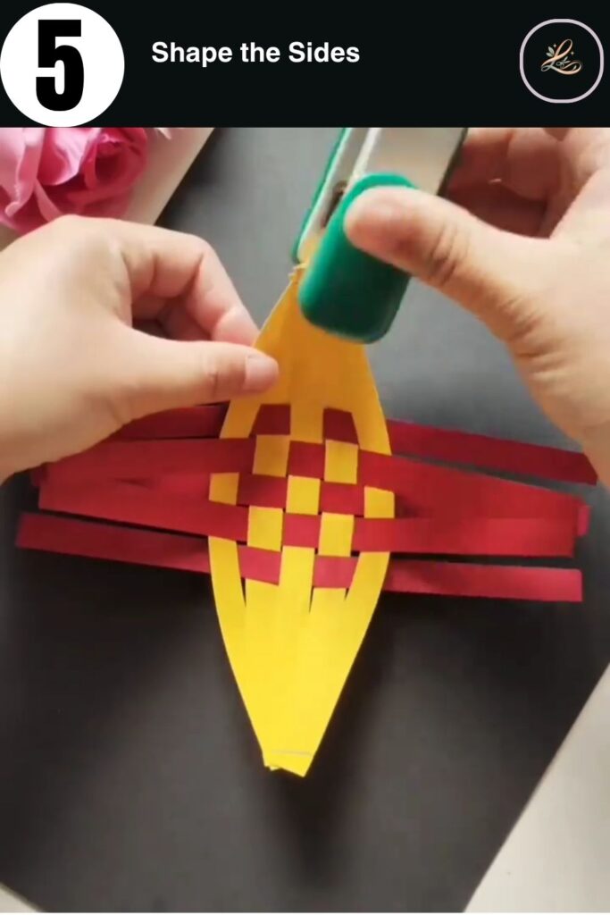 Overlapping red paper strips to create the sides of the boat.