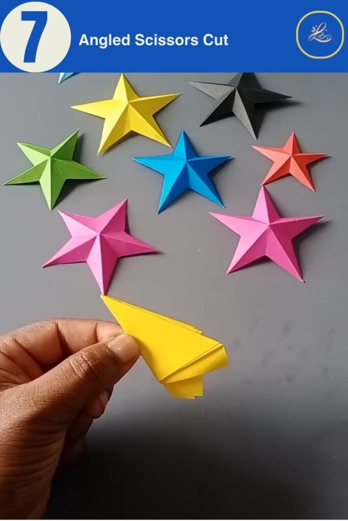 Slicing the folded paper wedge with scissors at a sharp angle.