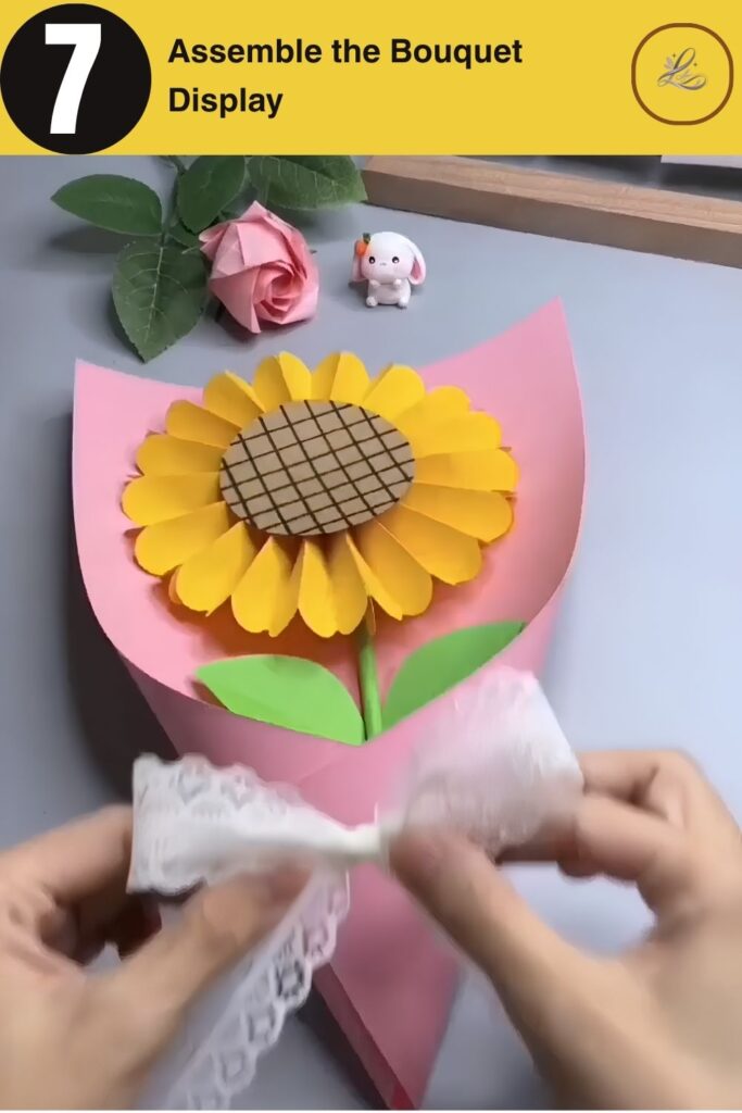 Bright Paper Sunflower Bouquet Anyone Can Make Final assembly of a wrapped paper sunflower bouquet with a ribbon.