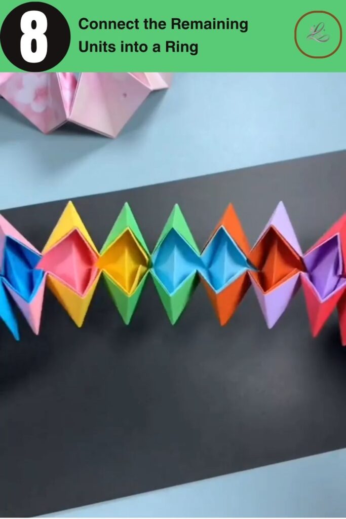 Connecting the final modular pieces together to complete the origami transforming star ring.
