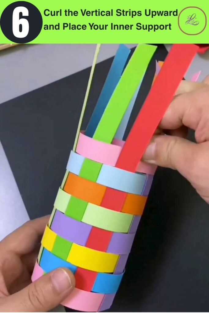 Fun Rainbow Woven Paper Pencil Holder DIY (#1) Hands curling colorful paper strips upward into a cylinder shape with a clear plastic inner support DIY woven paper pencil holder taking form