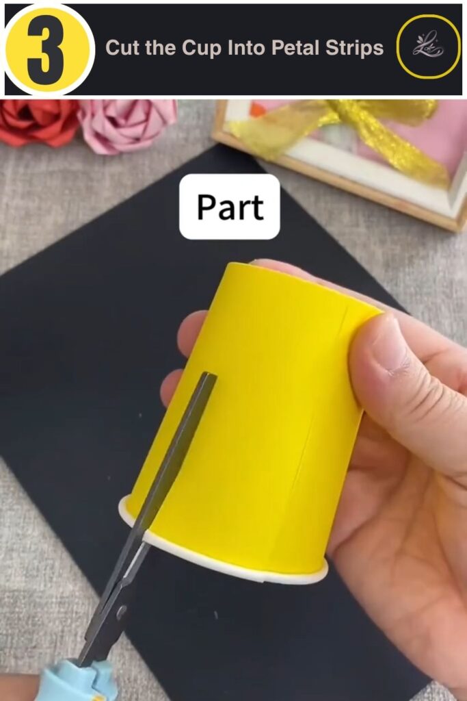 Cutting a paper cup into six petal strips for a kids pinwheel craft