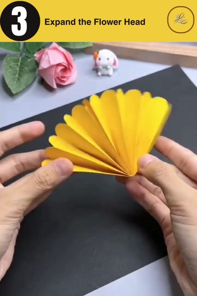 Bright Paper Sunflower Bouquet Anyone Can Make Fanning out accordion folds to create a paper flower head.