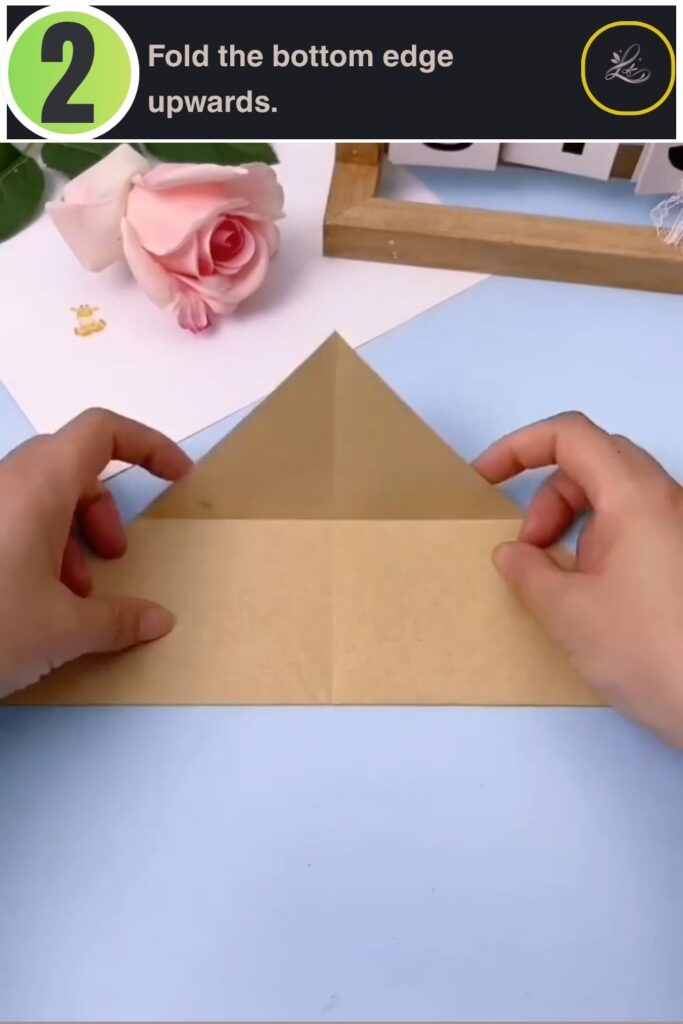 Creating a wide horizontal fold across the lower section of paper.