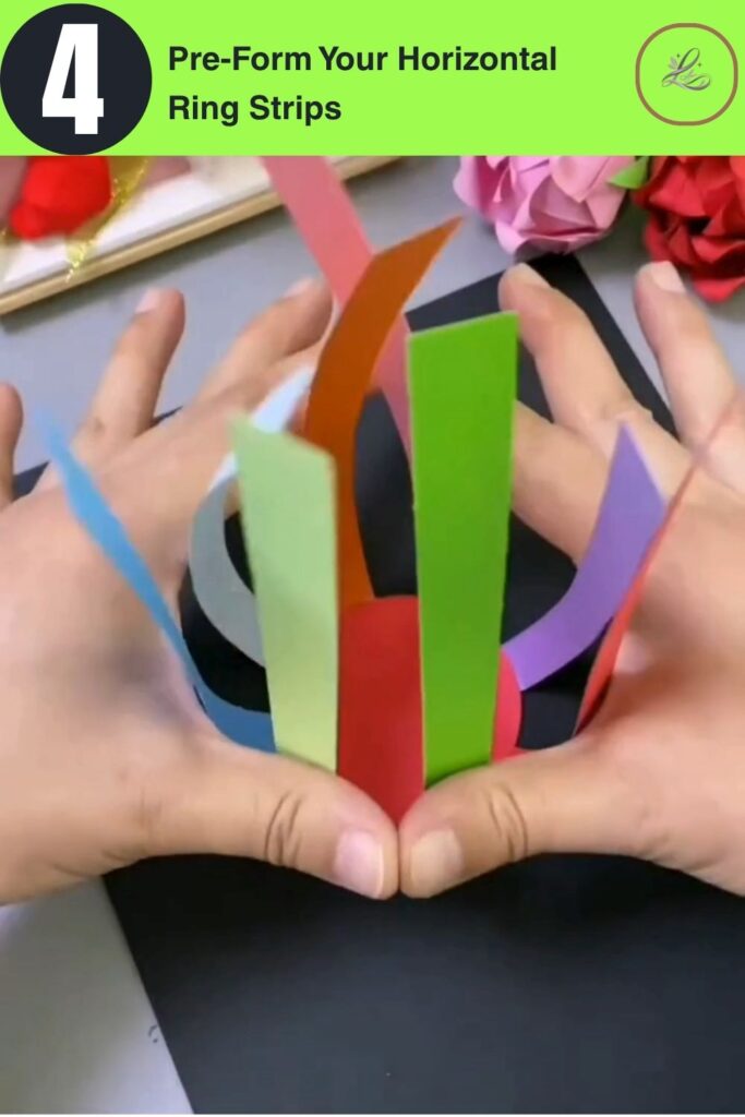 Fun Rainbow Woven Paper Pencil Holder DIY (#1) Hands flexing a yellow paper strip flat to pre-form it before curling into a ring for a DIY woven paper pencil holder