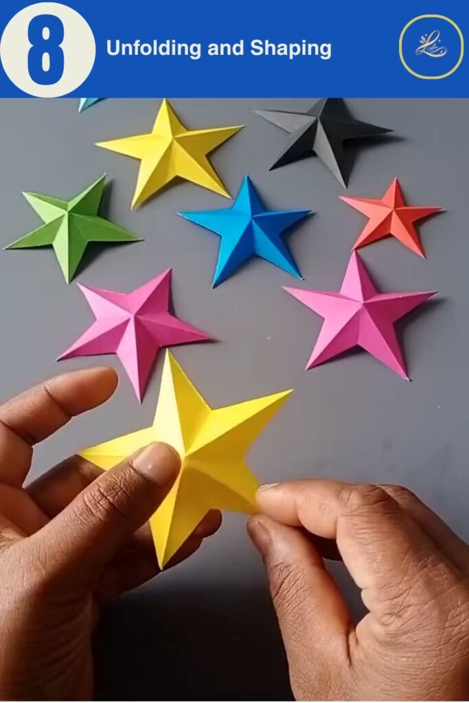 The finished vibrant yellow 3D origami paper star resting on a table.