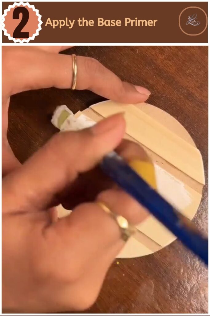 Cute DIY Inspirational Wall Hanging Anyone Can Make Applying white gesso primer to wooden craft sticks with a paintbrush.