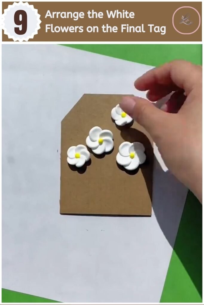 Beautiful Air Dry Clay Flower Wall Decor for Beginners Finished white clay flower cluster on a kraft cardboard wall decor tag