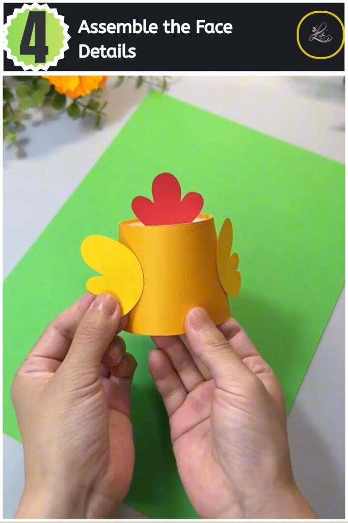 Adorable Paper Cup Chicken Craft for Beginners (#1) Gluing googly eyes and a paper beak onto the face of a yellow paper cup chick.