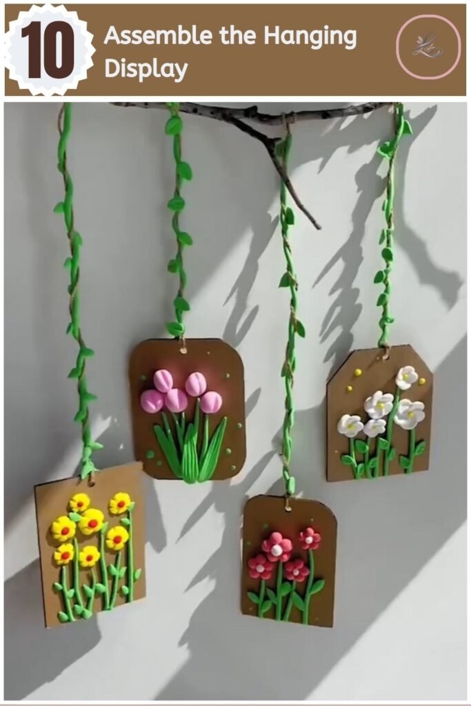 Beautiful Air Dry Clay Flower Wall Decor for Beginners Finished air dry clay flower wall decor hanging from a branch with vine-wrapped twine