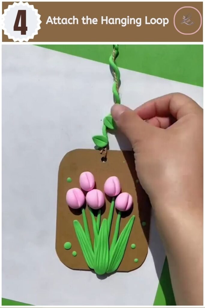 Beautiful Air Dry Clay Flower Wall Decor for Beginners Attaching a hanging loop with pliers to a clay flower tag for wall decor