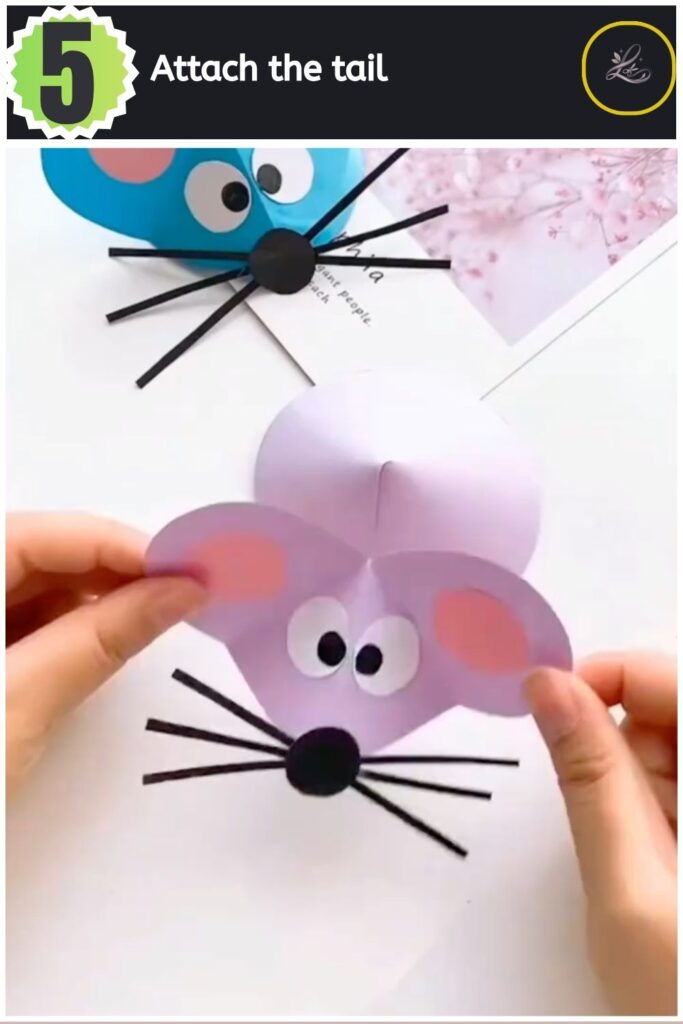 Adorable Paper Mouse Craft For Beginners Attaching a curled paper tail to the back of the handmade mouse.
