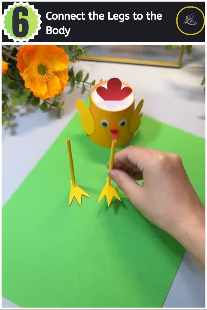 Adorable Paper Cup Chicken Craft for Beginners (#1) Mounting rolled yellow paper legs to the inside bottom rim of a paper cup chicken craft.