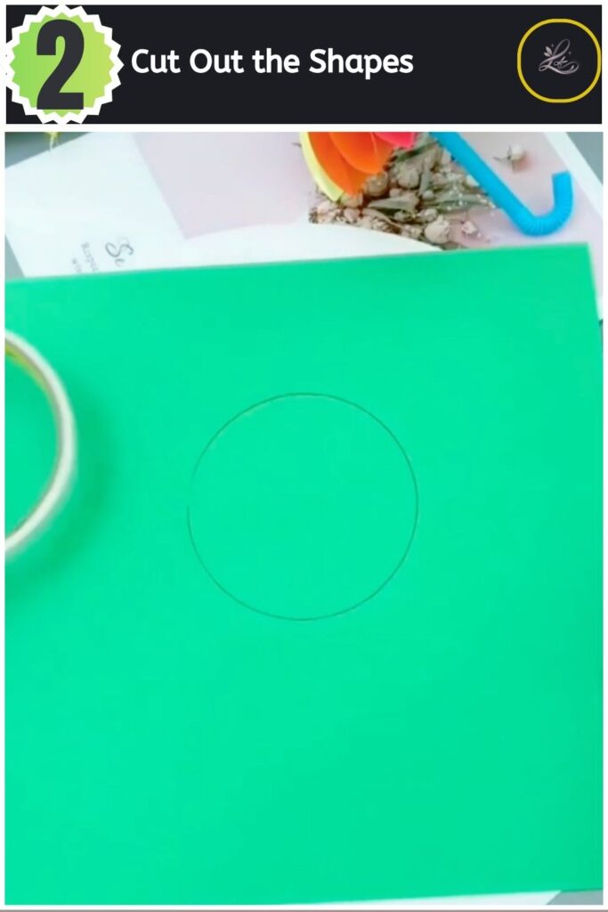 Cutting a green paper circle with small gold sciss