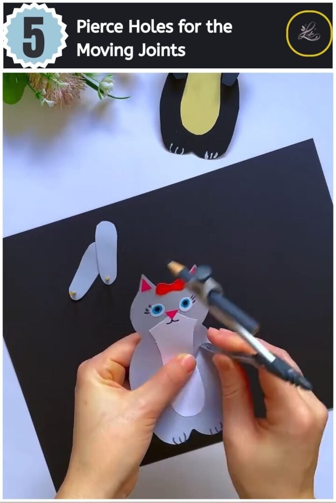Cute Paper Cat Peekaboo Toy Step by Step Piercing a small hole in the shoulder of a paper cat using a compass.