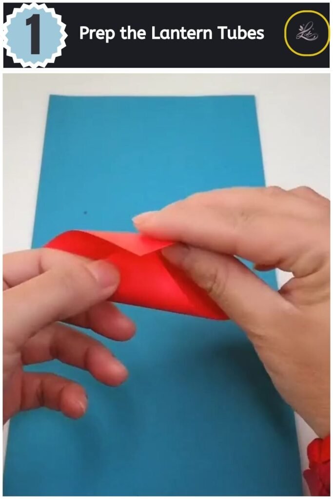 Beautiful Handmade Paper Lantern Craft Rolling a square sheet of red craft paper to create a small open tube for a lantern.