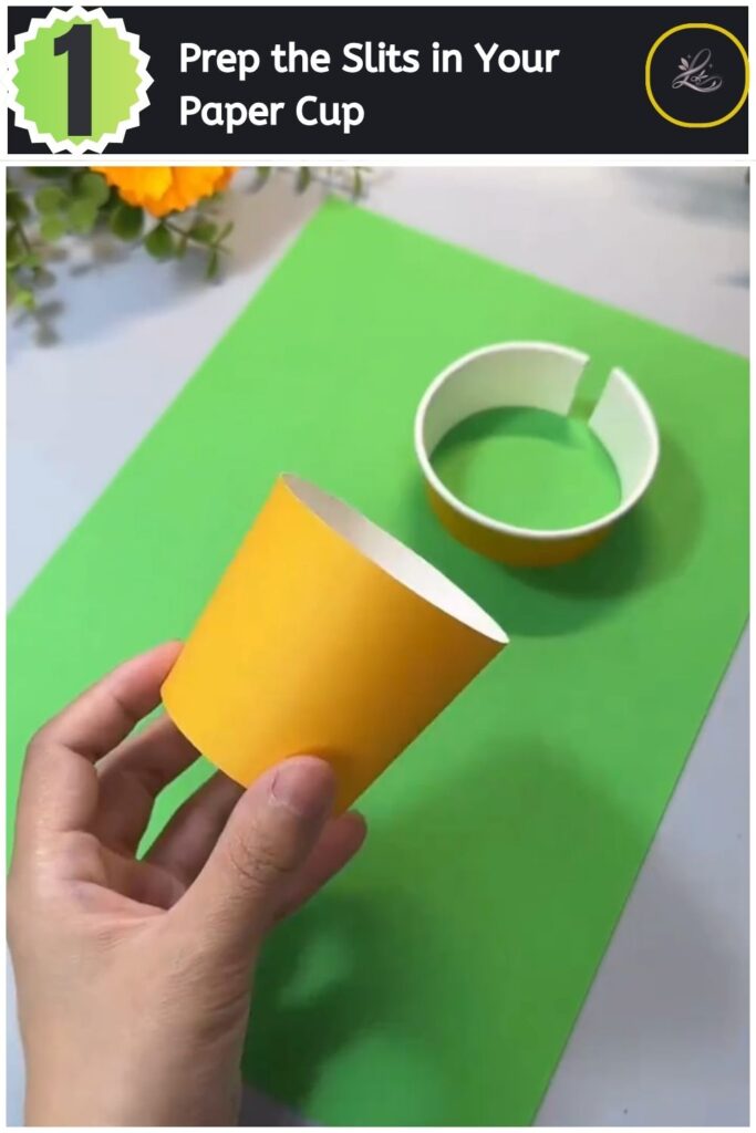 Adorable Paper Cup Chicken Craft for Beginners (#1) Poking side slots into an inverted yellow paper cup using scissors for a chicken craft.