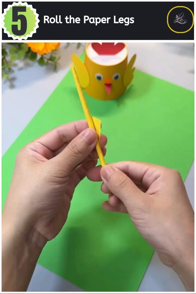 Adorable Paper Cup Chicken Craft for Beginners (#1) Rolling a yellow paper sheet over a pencil to create structural paper legs for a craft.