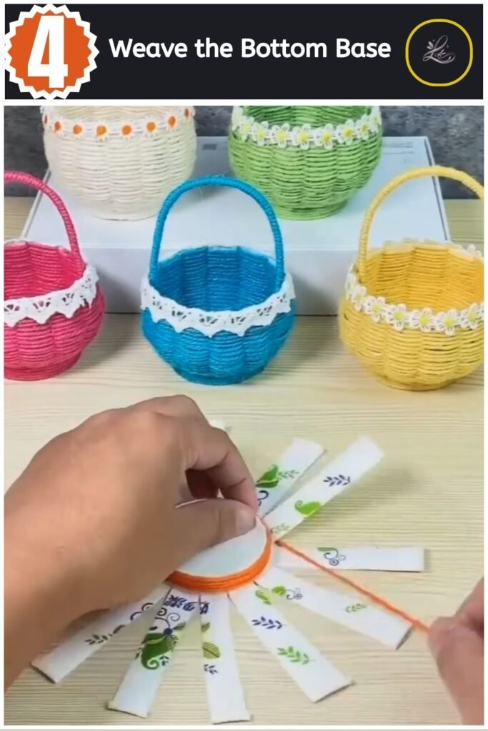 Weaving bright orange yarn tightly around the center base of the paper cup frame.