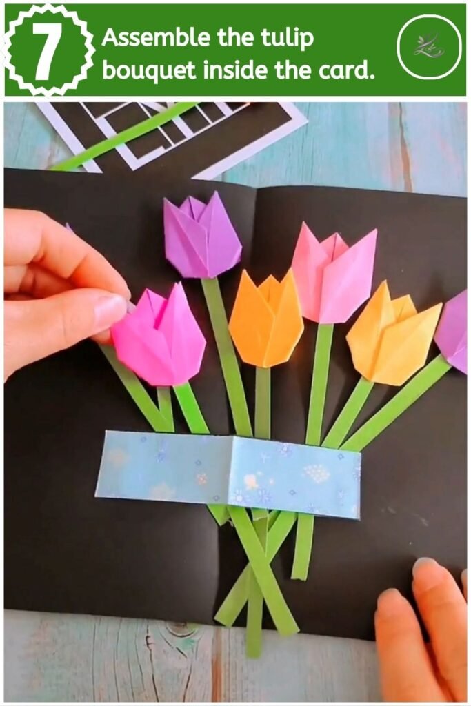 Inserting colorful paper tulips into the pop-up vase holder inside the card.