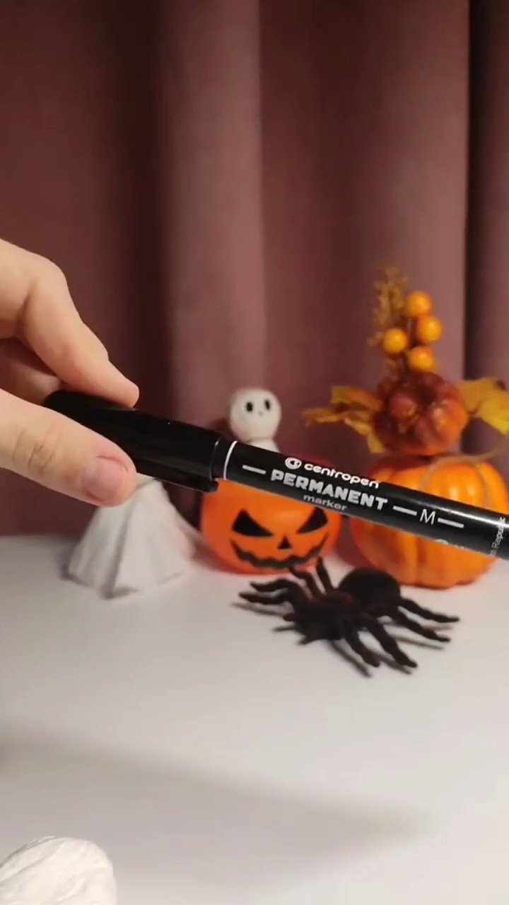 Easy DIY Paper Towel Ghosts (5-Minute Halloween Craft) Drawing cute face on DIY paper ghost with black marker