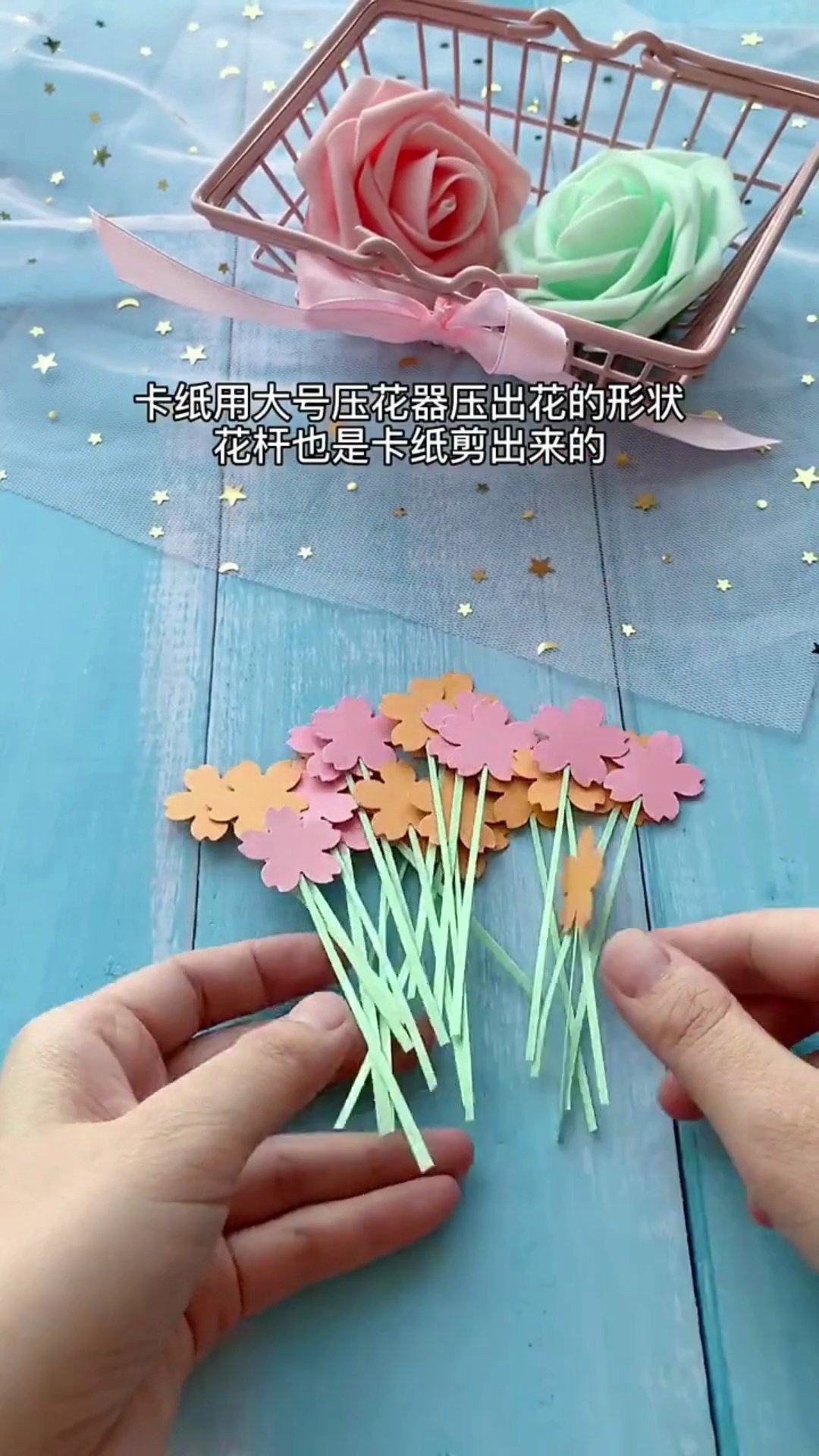 Punching paper flower heads and attaching to thin paper stems