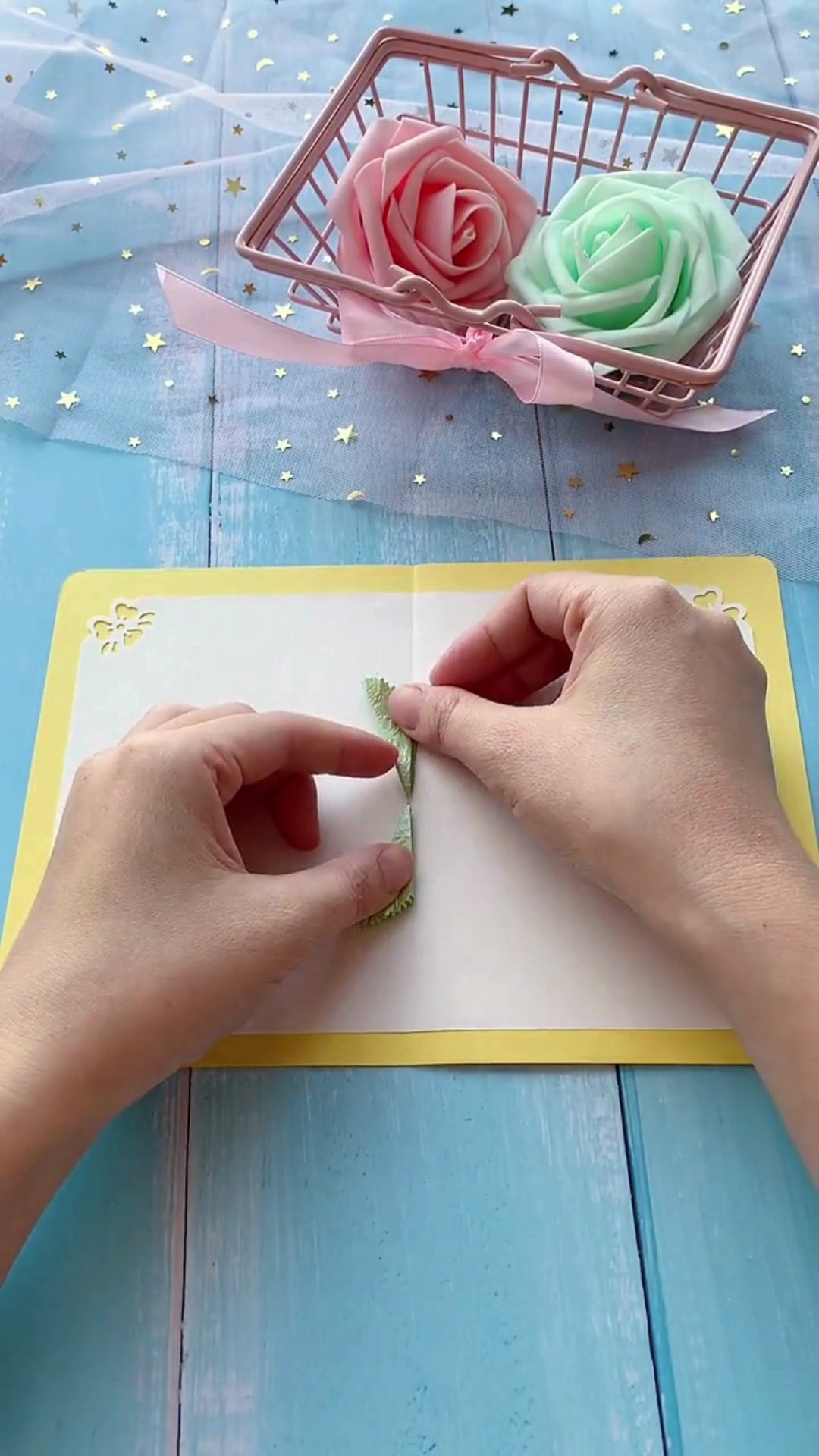 Gluing green accordion pop-up base to card center fold